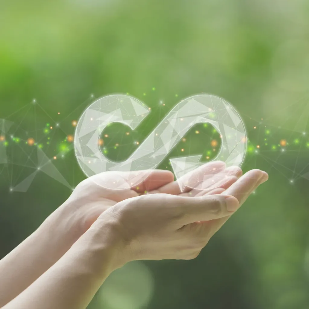 Το σύμβολο της κυκλικής οικονομίας ως θεμέλιος λίθος για την κυκλική αρχιτεκτονική και τον βιώσιμο σχεδιασμό.